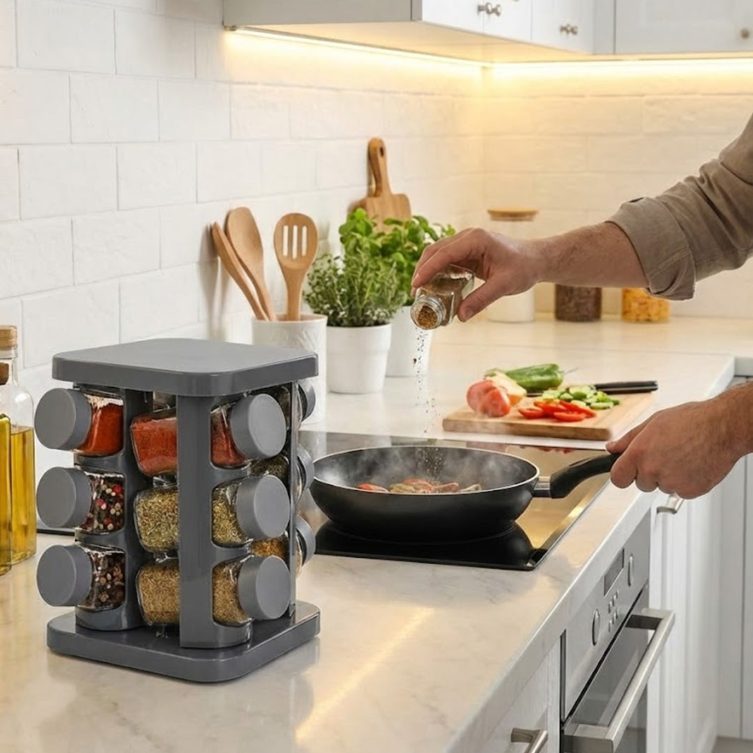 design compact si ergonomic: suport condimente Koken pe blat, in timp ce un recipient presara ierburi intr-o oala pe plita